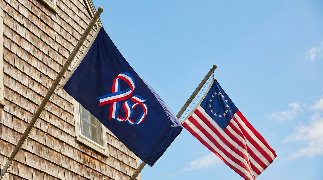 Official America 250 flag and Betsy Ross 13-star flag flying side by side on house-mount poles for the 2026 Semiquincentennial