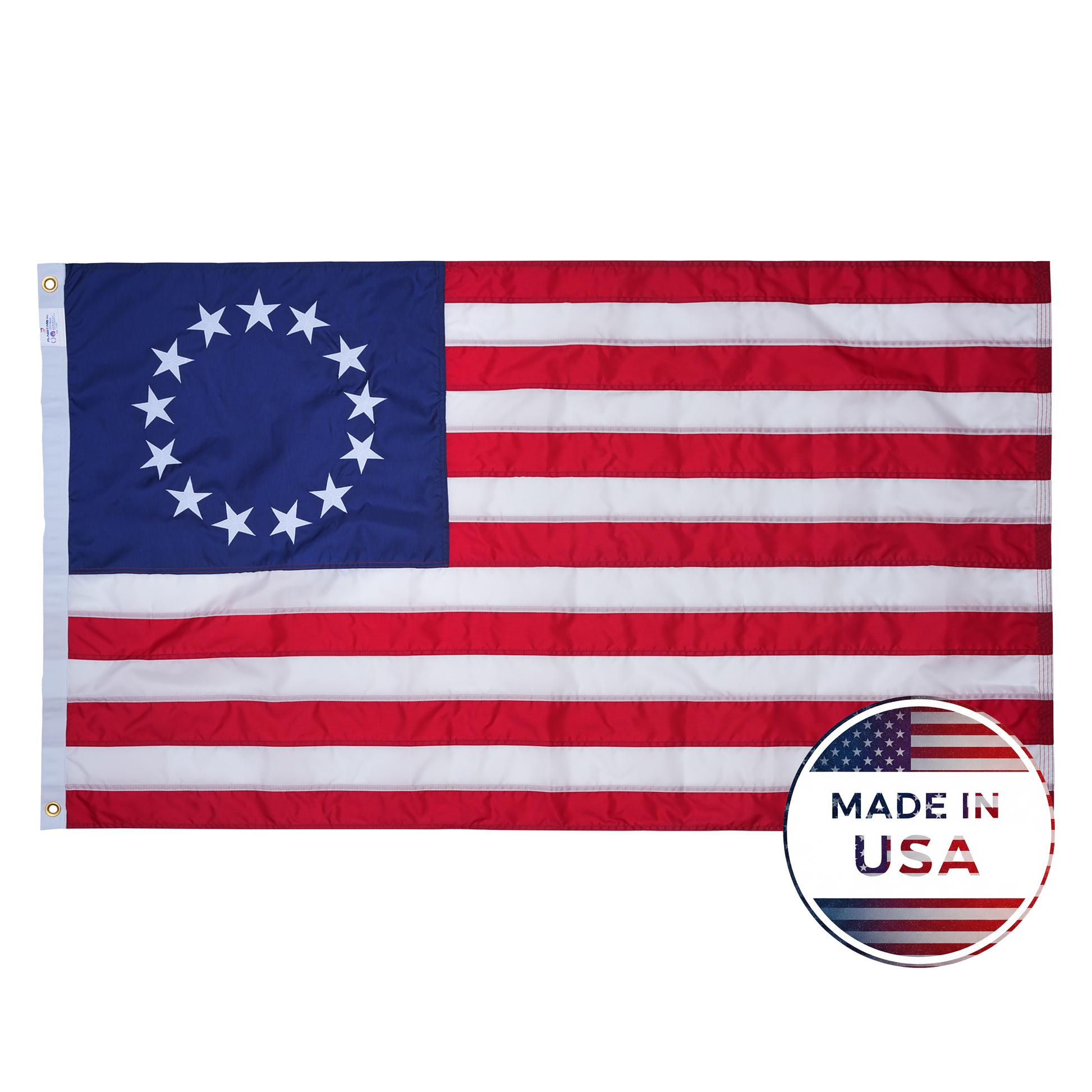 The Flag Stars Inc Nylon Betsy Ross Flag, 100% Made in USA, features 13 embroidered stars in a circle, 13 red and white stripes, and is crafted from durable nylon for lasting quality.