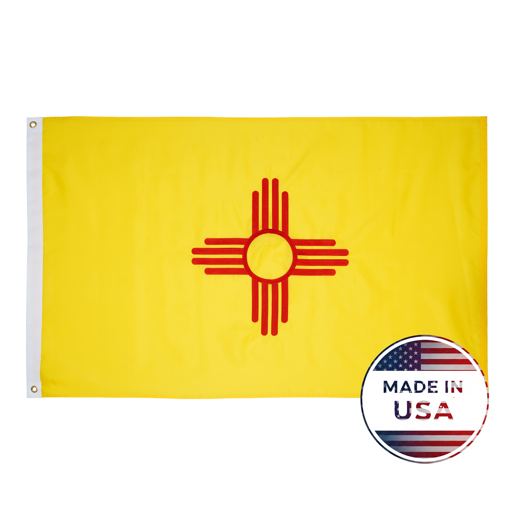 The New Mexico State Flag by Flag Stars Inc features the red Zia sun on yellow, with a "Made in USA" badge and American flag in the lower right corner. Durable and outdoor ready—perfect for showing your New Mexico pride!.