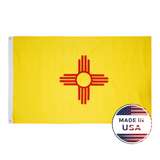 The New Mexico State Flag by Flag Stars Inc features the red Zia sun on yellow, with a "Made in USA" badge and American flag in the lower right corner. Durable and outdoor ready—perfect for showing your New Mexico pride!.