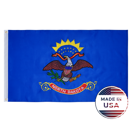 Flag Stars Inc’s North Dakota State Flag showcases a bald eagle on a blue field, detailed with raised embroidery and marked 100% Made in USA.