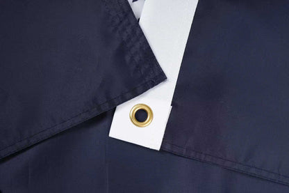 Close-up of overlapping dark blue and white fabric with a metal grommet—South Carolina State Flag by Flag Stars Inc, 100% made in the USA and built for outdoor use.