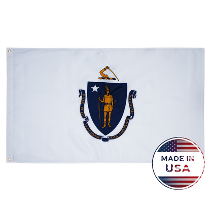 The Massachusetts State Flag by Flag Stars Inc features a Native American and star on a blue shield against white, with a Made in USA badge at the bottom right, highlighting its outdoor durability. 100% Made in USA.
