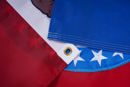 Close-up of the Missouri State Flag by Flag Stars Inc, showing red, white, and blue sections with stars, brass grommet, part of the state seal animal graphic, and premium raised embroidery—100% Made in USA for lasting outdoor use.