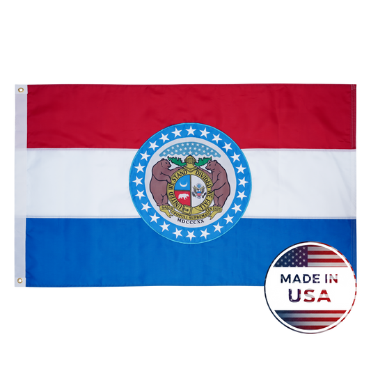 The Missouri State Flag by Flag Stars Inc features red, white, and blue stripes with the state seal centered; a "Made in USA" badge marks the lower right. 100% Made in USA and ideal for outdoor use.