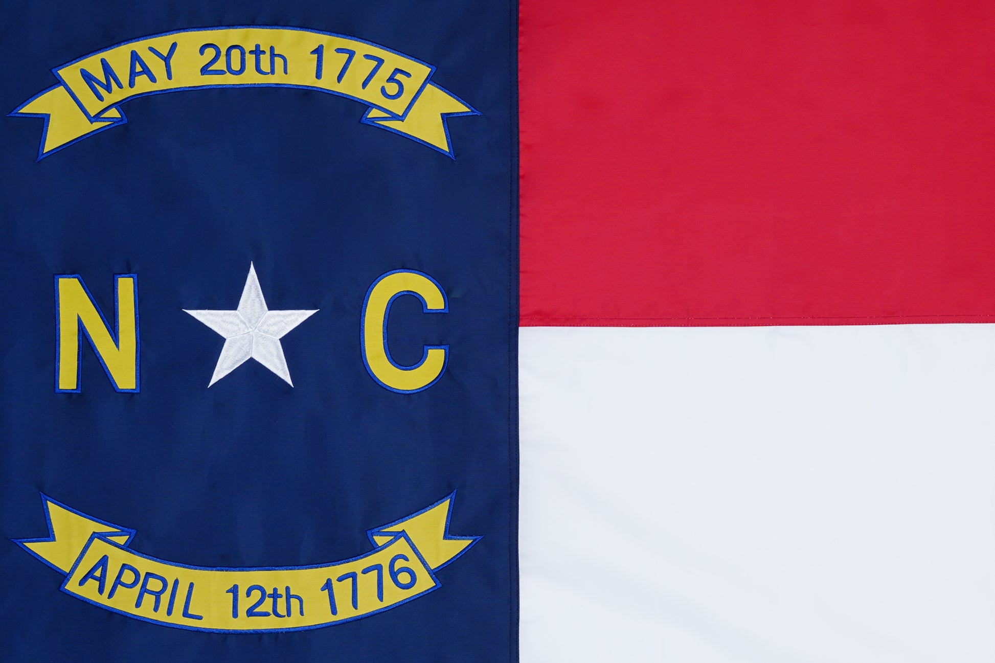 The North Carolina State Flag by Flag Stars Inc features its classic design and is 100% Made in USA, perfect for outdoor use.