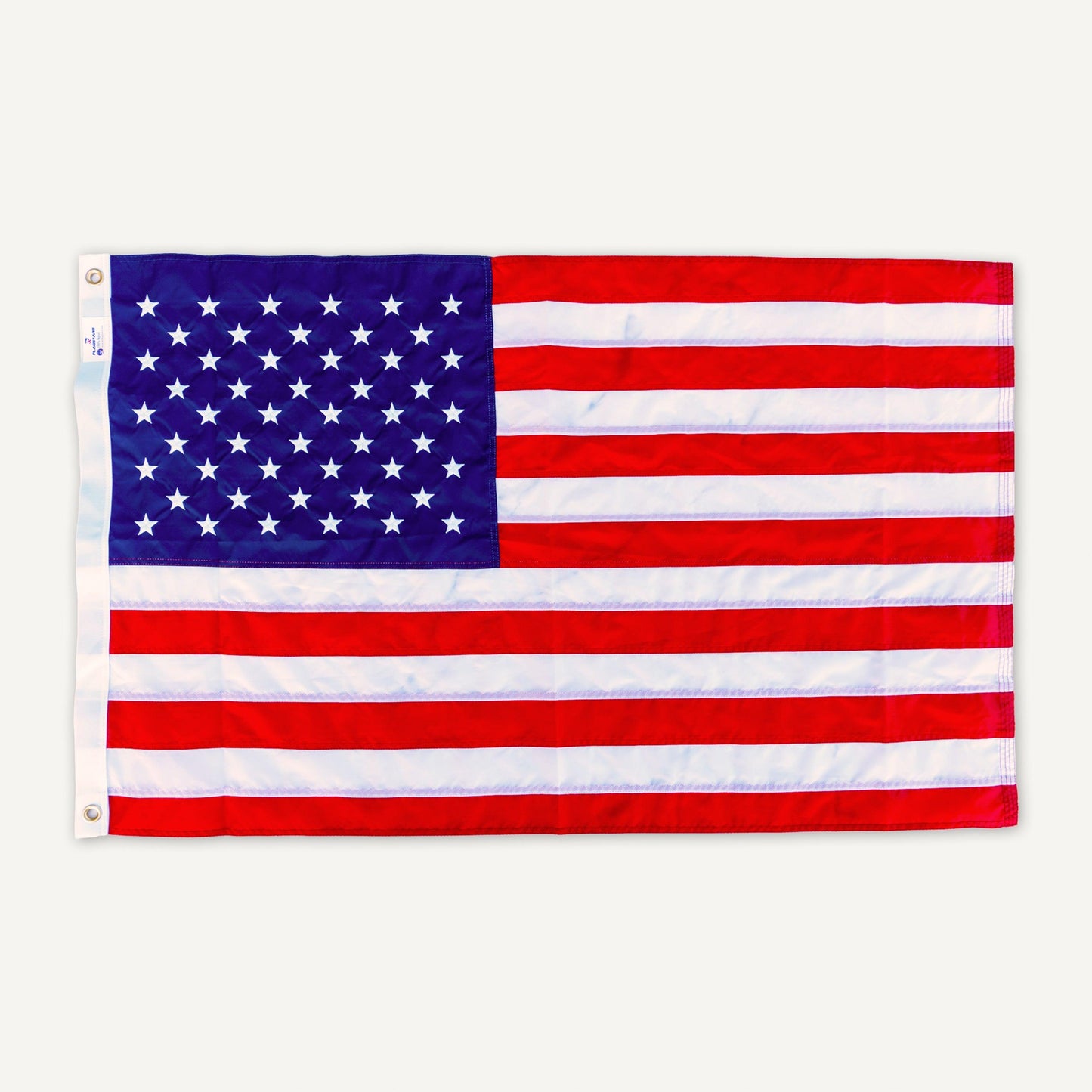A long lasting 2.5' X 4' AMERICAN FLAG with 50 white stars on a blue background in the top left corner and 13 red and white alternating stripes, proudly made in the USA by The FlagStars.